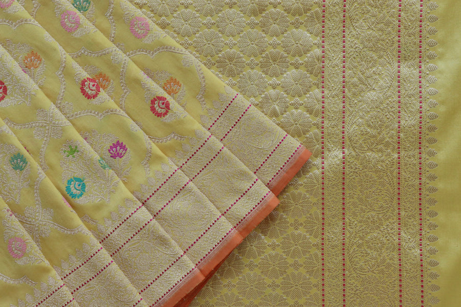 Silk texture of Lemon Yellow Meenadar Jangla saree