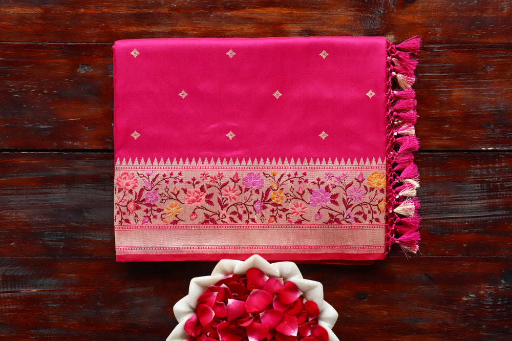 Rani Pink pure Katan silk Banarasi saree with meenakari motifs in coloured silk and zari, draped for the camera.