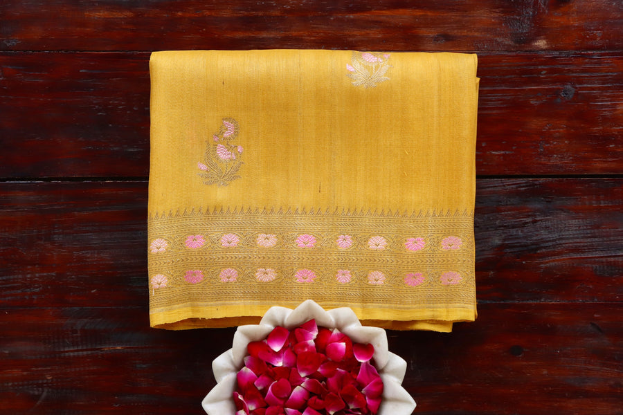 Yellow Guldasta pure Tussar silk Banarasi saree with thread-by-thread motifs, draped for the camera.