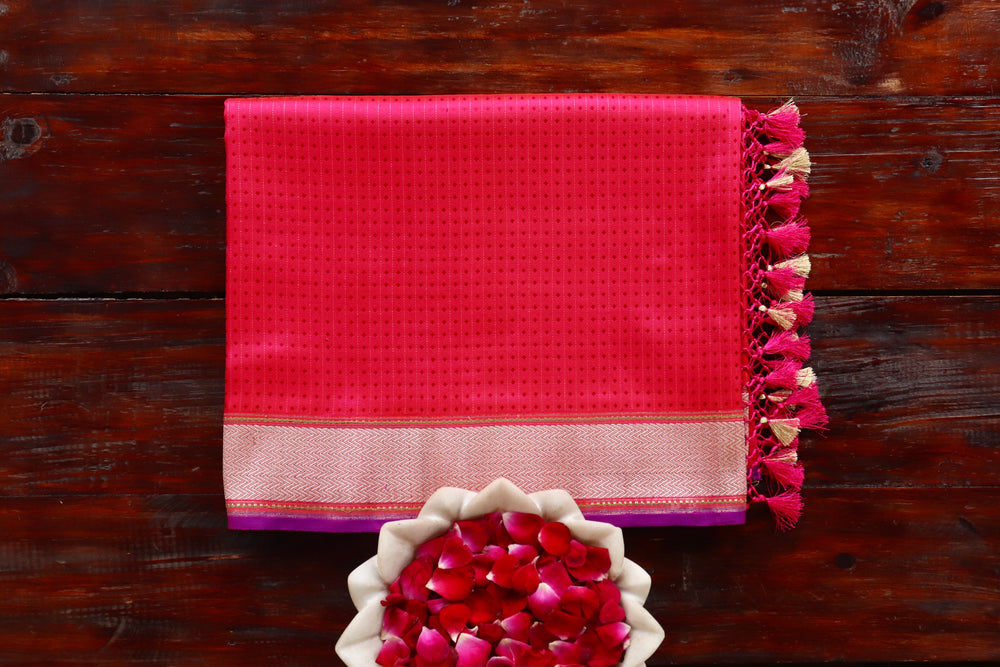 Pink Katan silk Banarasi saree with densely packed Tanchoi motifs, draped for the camera.