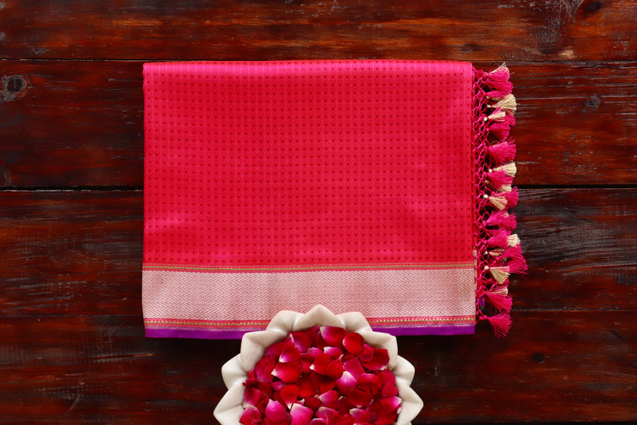 Pink Katan silk Banarasi saree with densely packed Tanchoi motifs, draped for the camera.