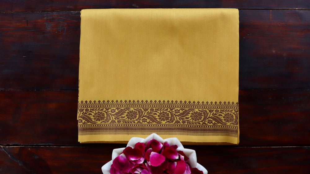 Yellow handloom Banarsi saree with kadhua motifs in pure silk
