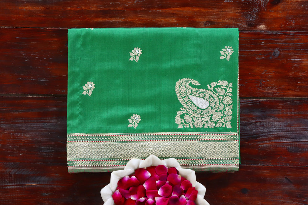 Green handloom Banarsi saree with kadhua motifs in pure silk