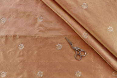 Peach pure Katan silk Banarasi fabric thaan with thread-by-thread motifs.