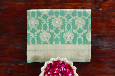 Green handloom Banarsi saree with jangla motifs in pure silk