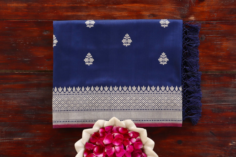 Navy Blue Leaf Katan silk Banarasi saree with thread-by-thread motifs, draped for the camera.
