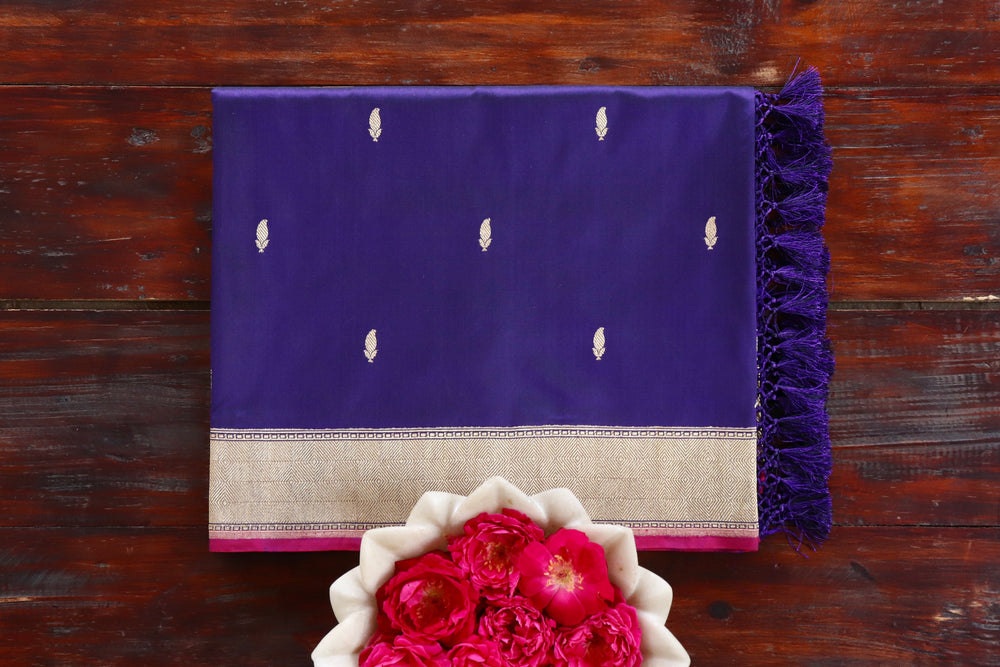 Navy Blue pure Katan silk Banarasi saree with Kairy paisley motifs, draped for the camera.