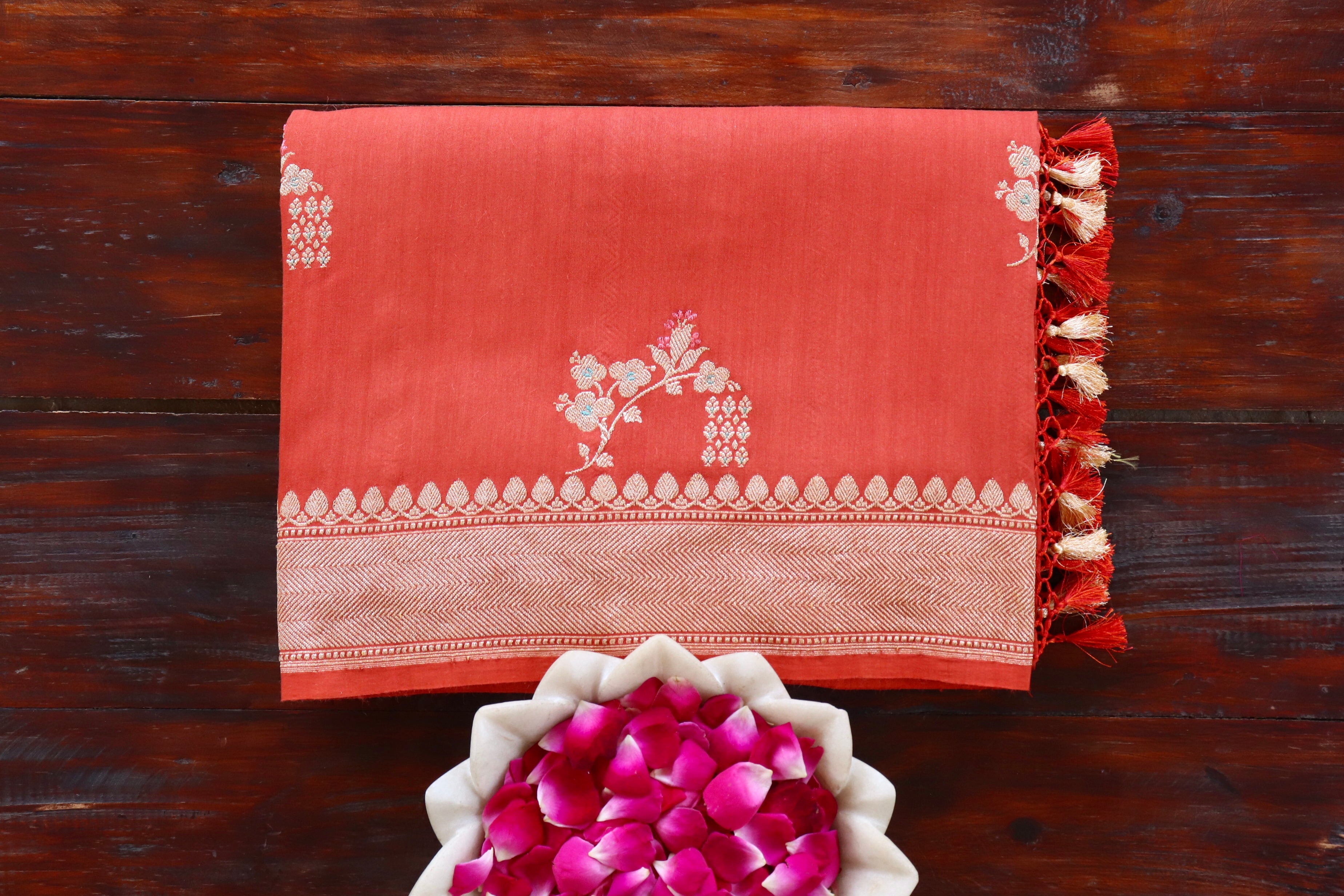 Rust handloom Banarsi saree with kadhua motifs in Munga silk