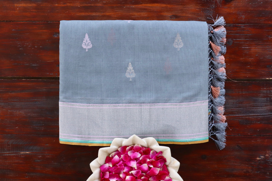 Grey Cotton Banarasi saree with thread-by-thread motifs, draped for the camera.
