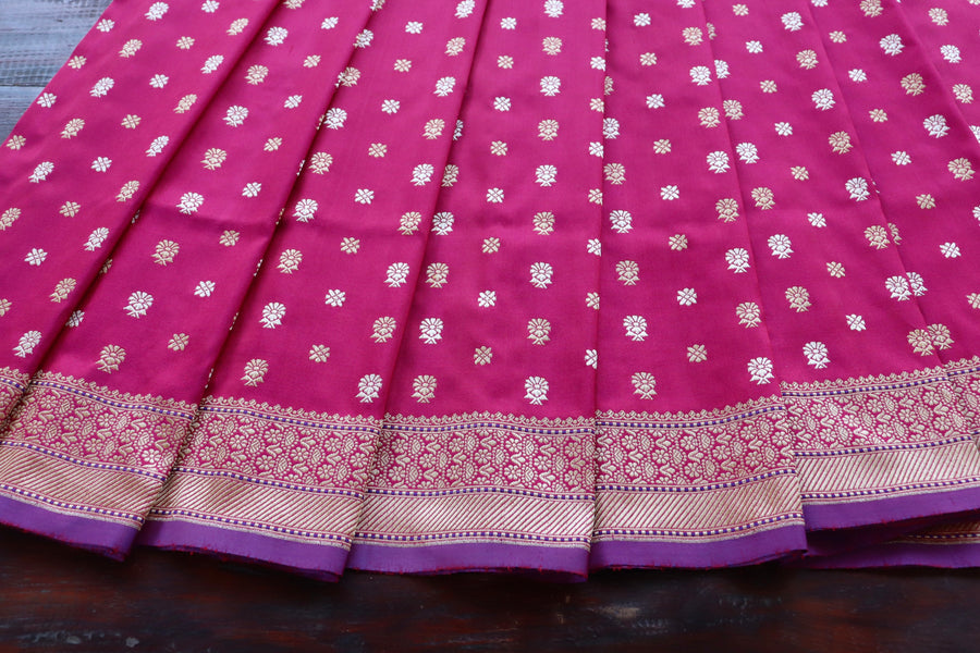 Aanchal motif on Magenta pure zari Banarasi saree