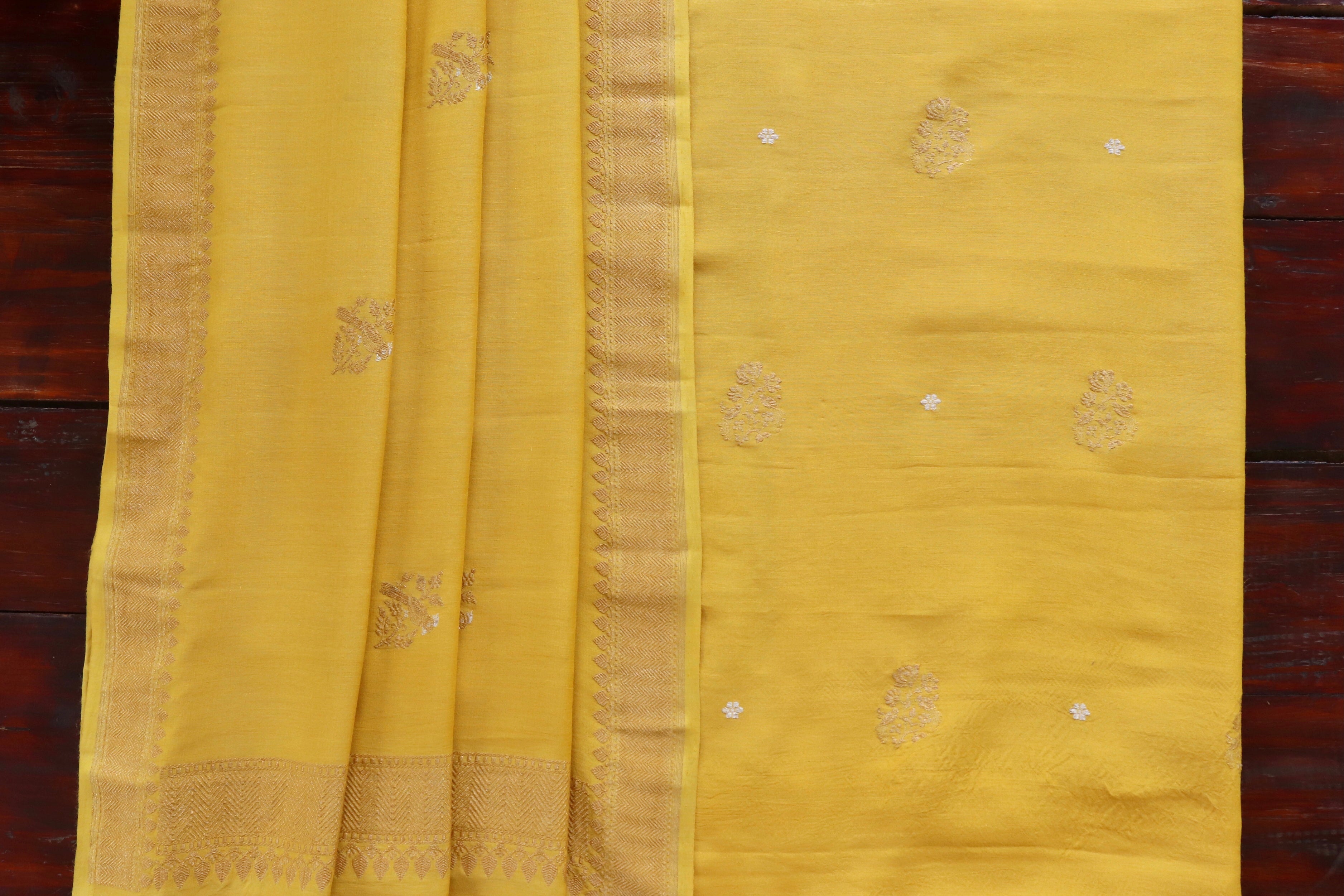 Yellow Munga Munga silk Banarasi suit set with thread-by-thread motifs.