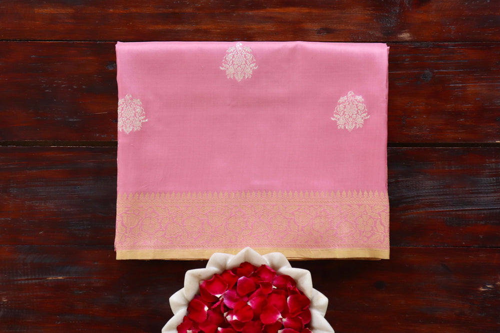 Pink pure Katan silk Banarasi saree with thread-by-thread motifs, draped for the camera.