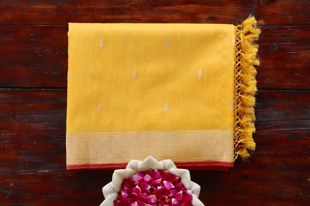 Yellow handloom Banarsi saree with kairy motifs in pure Kora silk