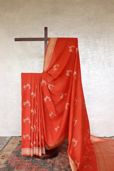 Orange handloom Banarsi saree with kadhua motifs in Munga silk