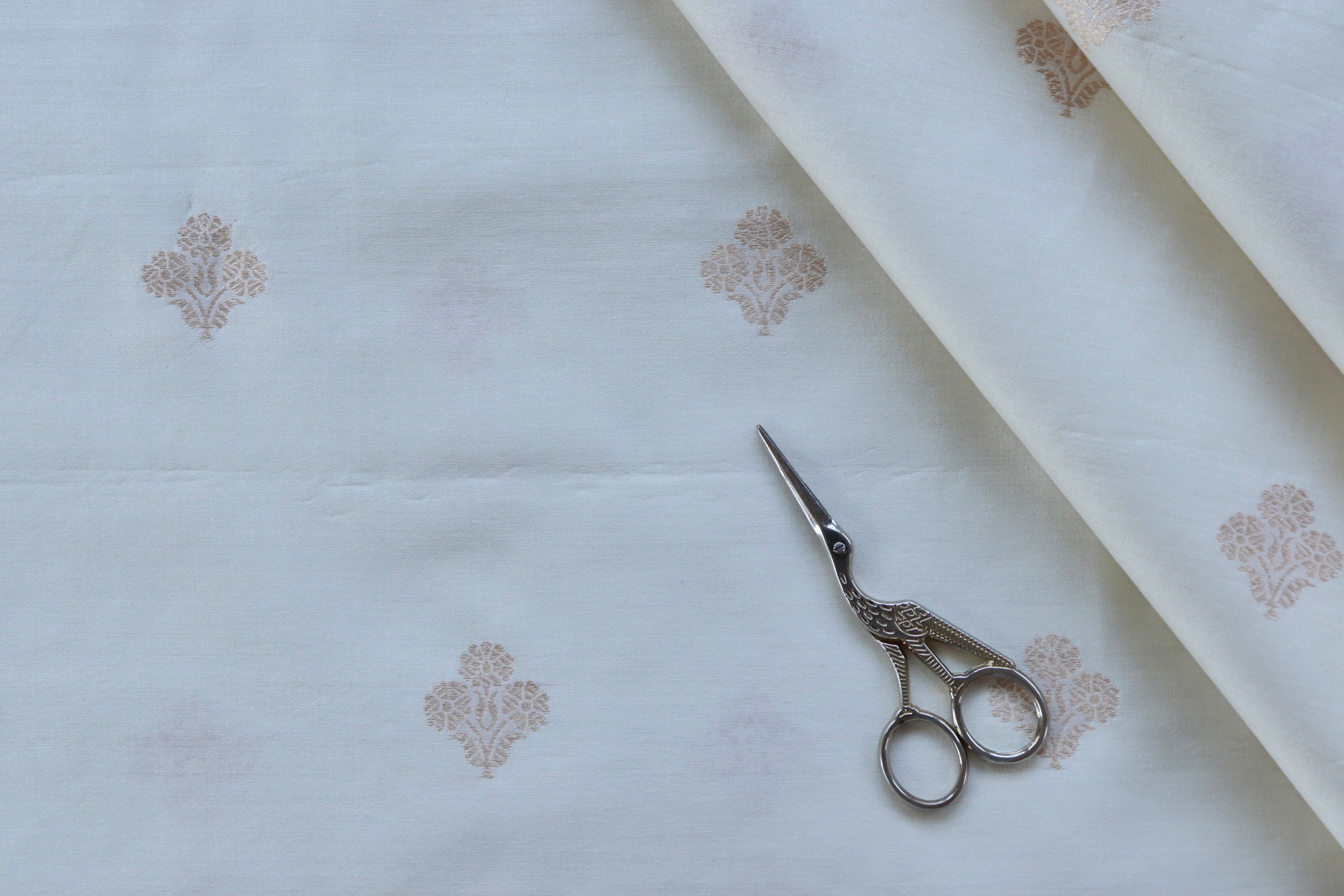 White Floral Motif Silk By Cotton Handloom Fabric Thaan