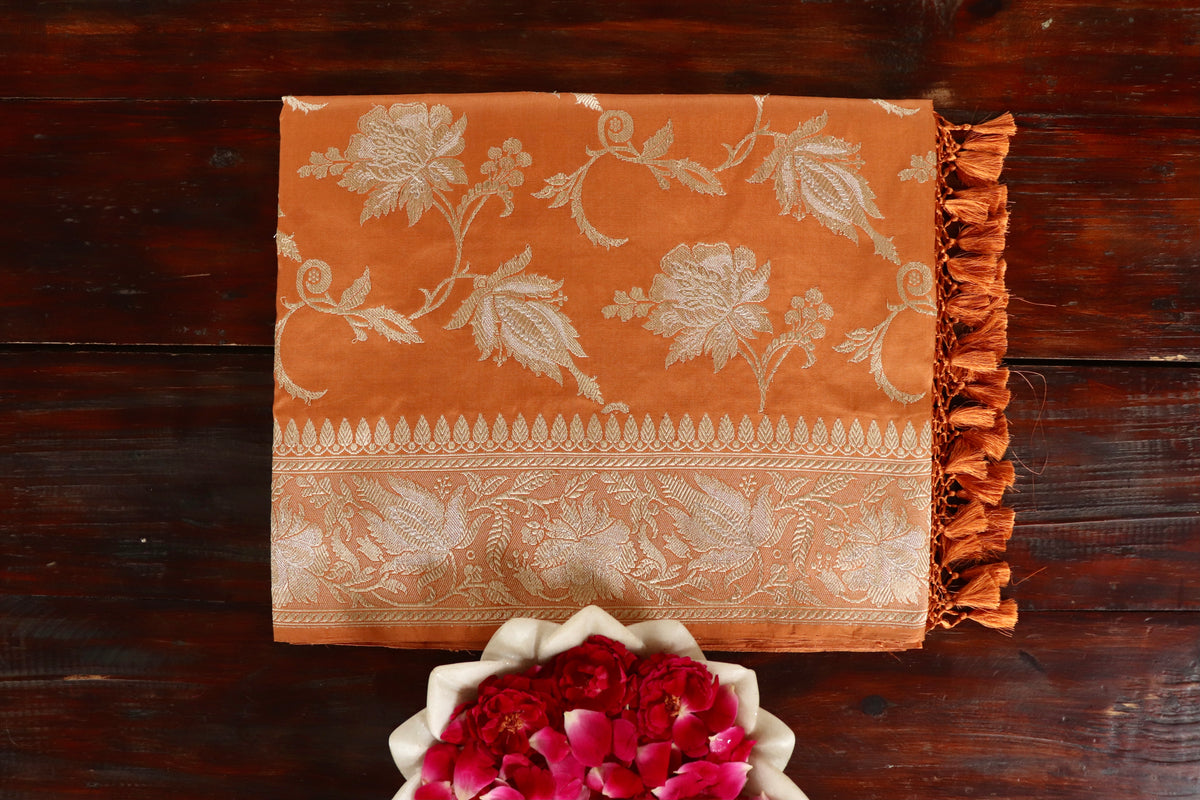 Rust handloom Banarsi saree with jangla motifs in pure silk