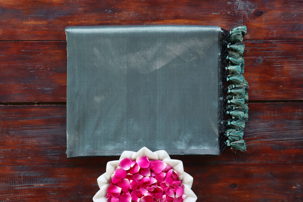 Deep Green Tissue By silk Banarasi saree with thread-by-thread motifs, draped for the camera.