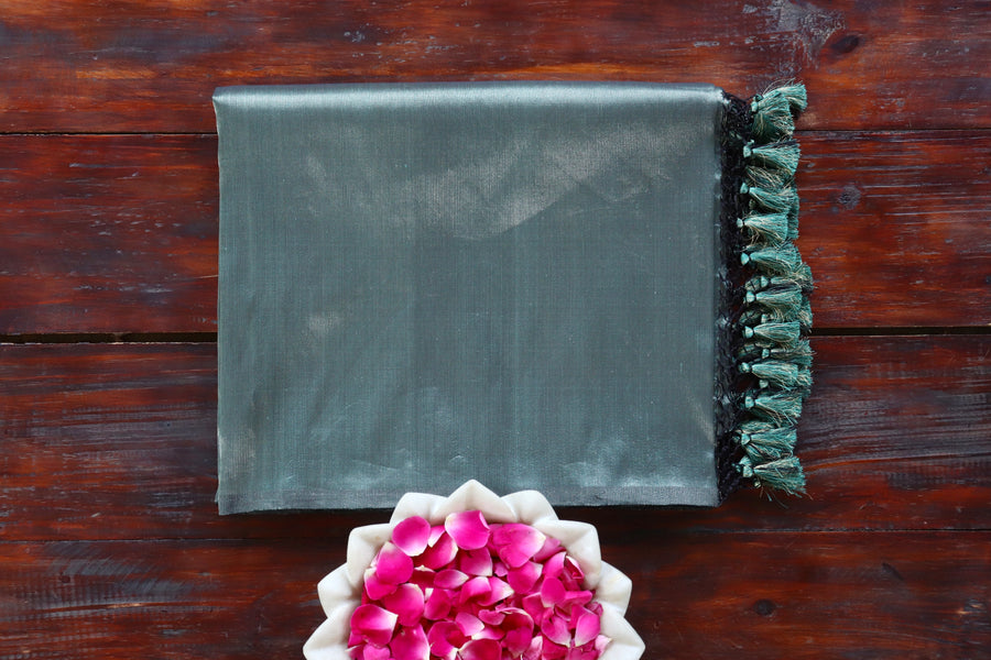 Deep Green Tissue By silk Banarasi saree with thread-by-thread motifs, draped for the camera.