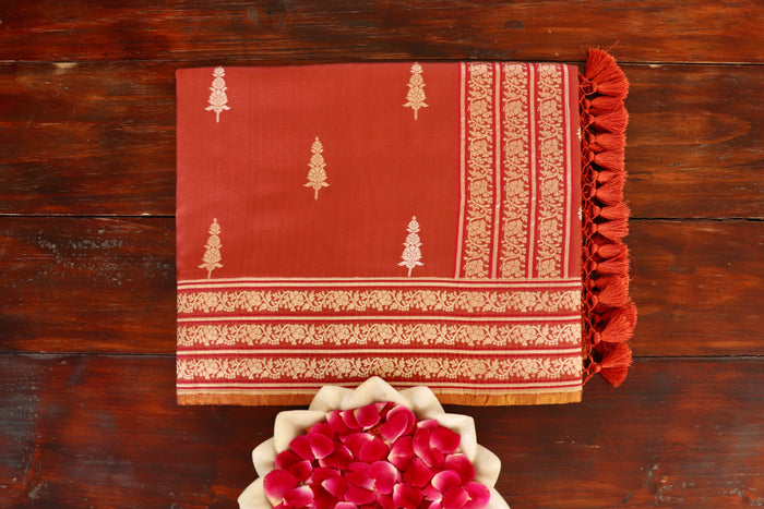 Rust handloom Banarsi saree with buti motifs in pure silk