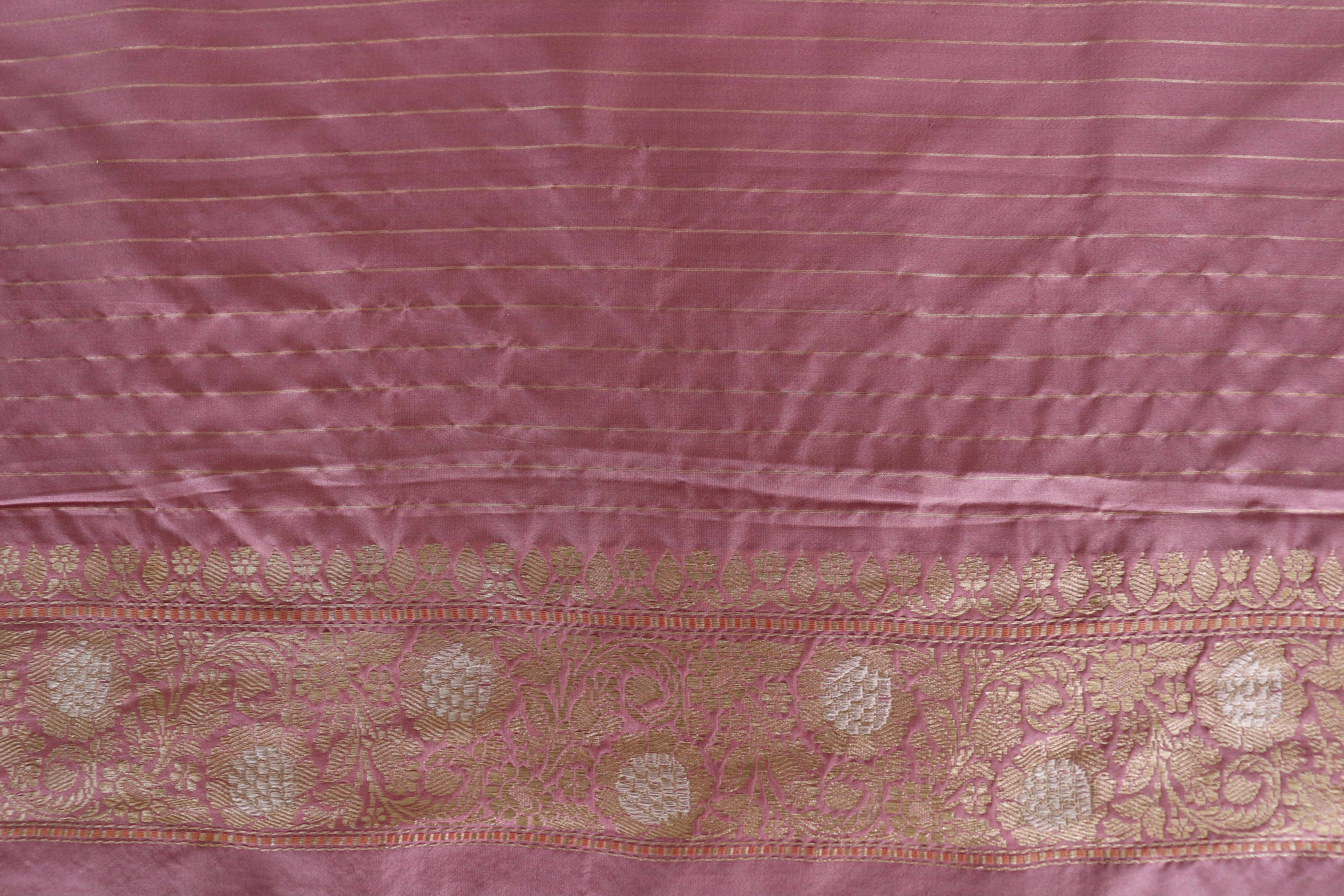 A rose Banarasi border carrying a continuous vine of grapes and leaves in zari