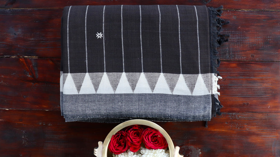 Dark Brown naturally-dyed handwoven Kotpad saree draped for the camera