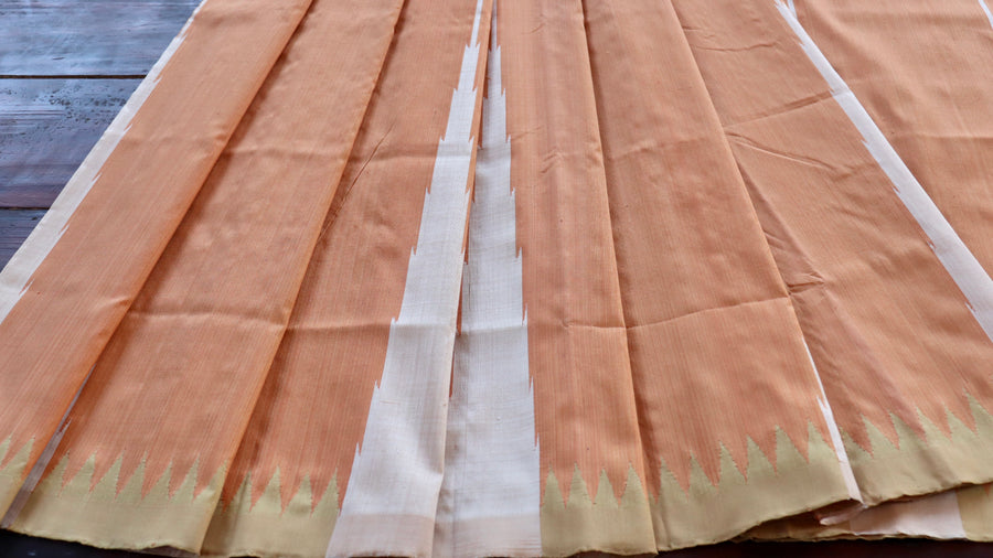 Ikat resist-dye motif on Peach Mulberry silk saree