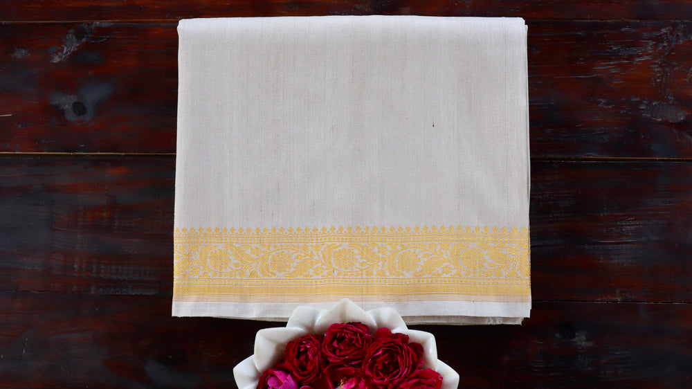 Ivory Kuniya pure silk handloom Banarasi saree draped for the camera